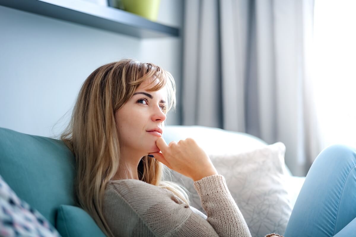 Shutterstock: Woman at home deep in thoughts thinking and planning