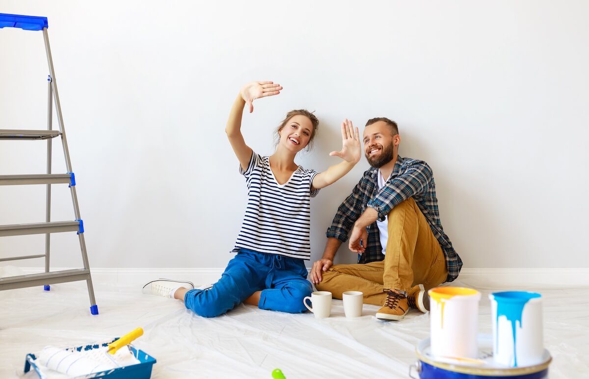 Shutterstock: young happy family married couple dreams of renovating house and planning a design project