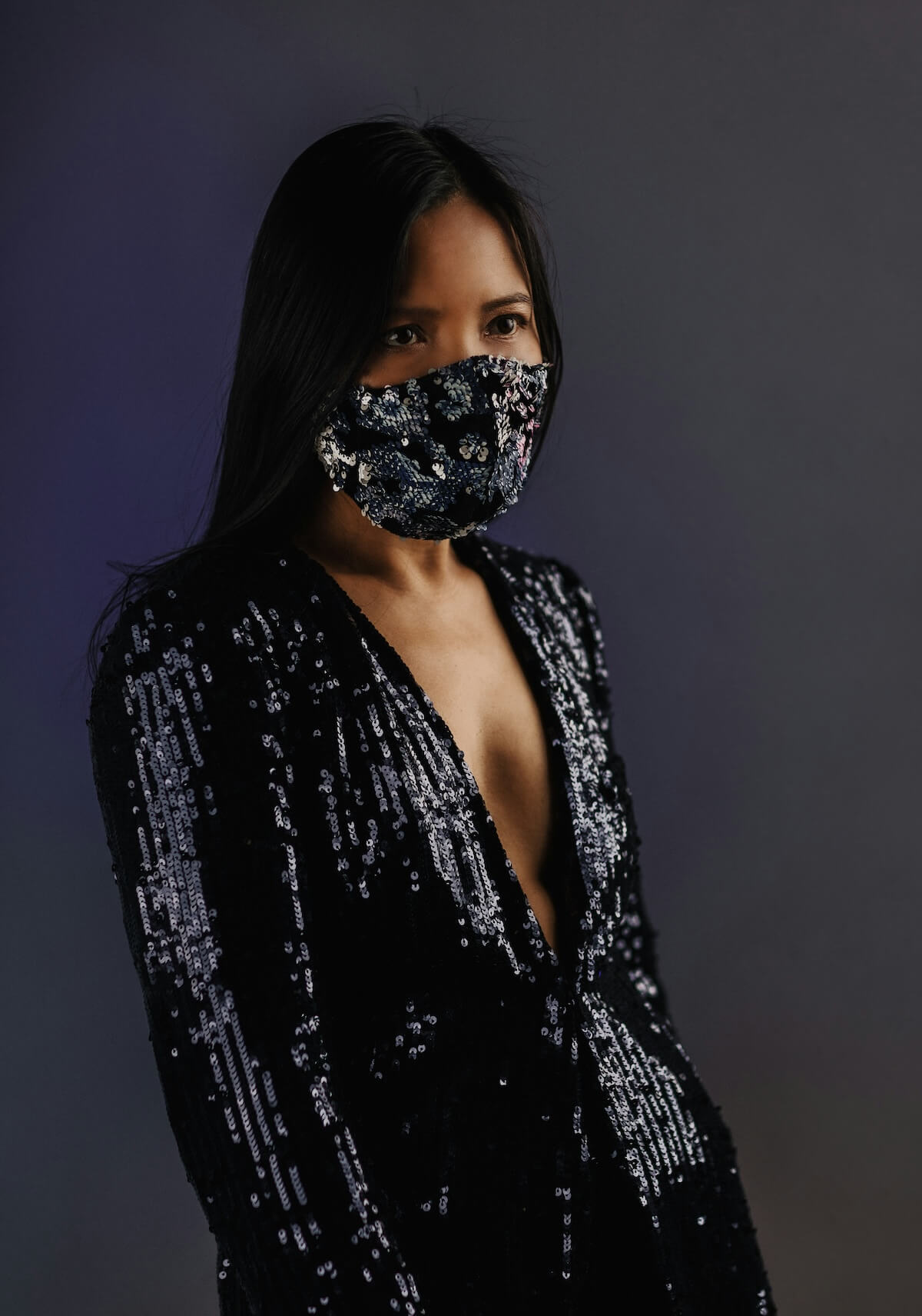 Unsplash: Woman in sequin dress and mask by Andrea Weiss
