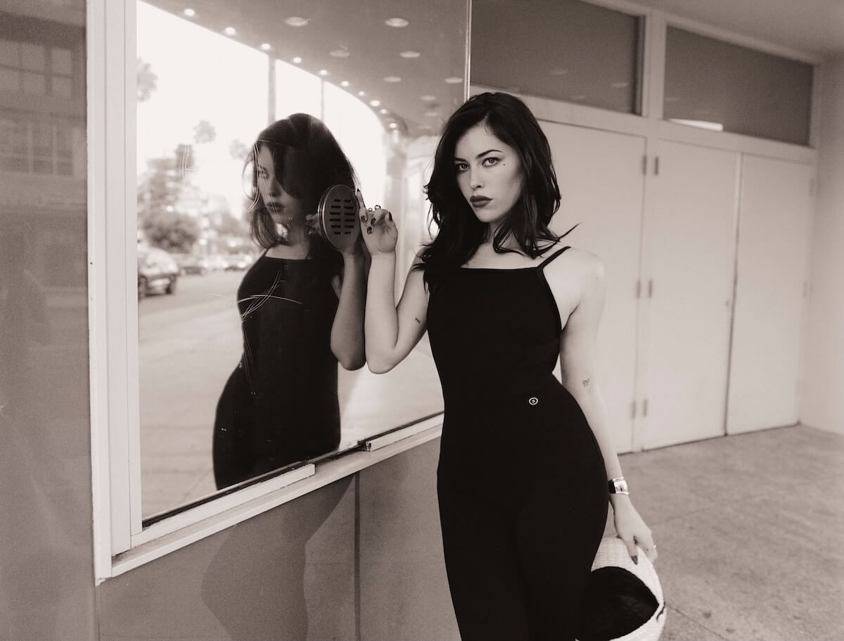 Cynthia Parker Love Song promo image with reflection in ticket window