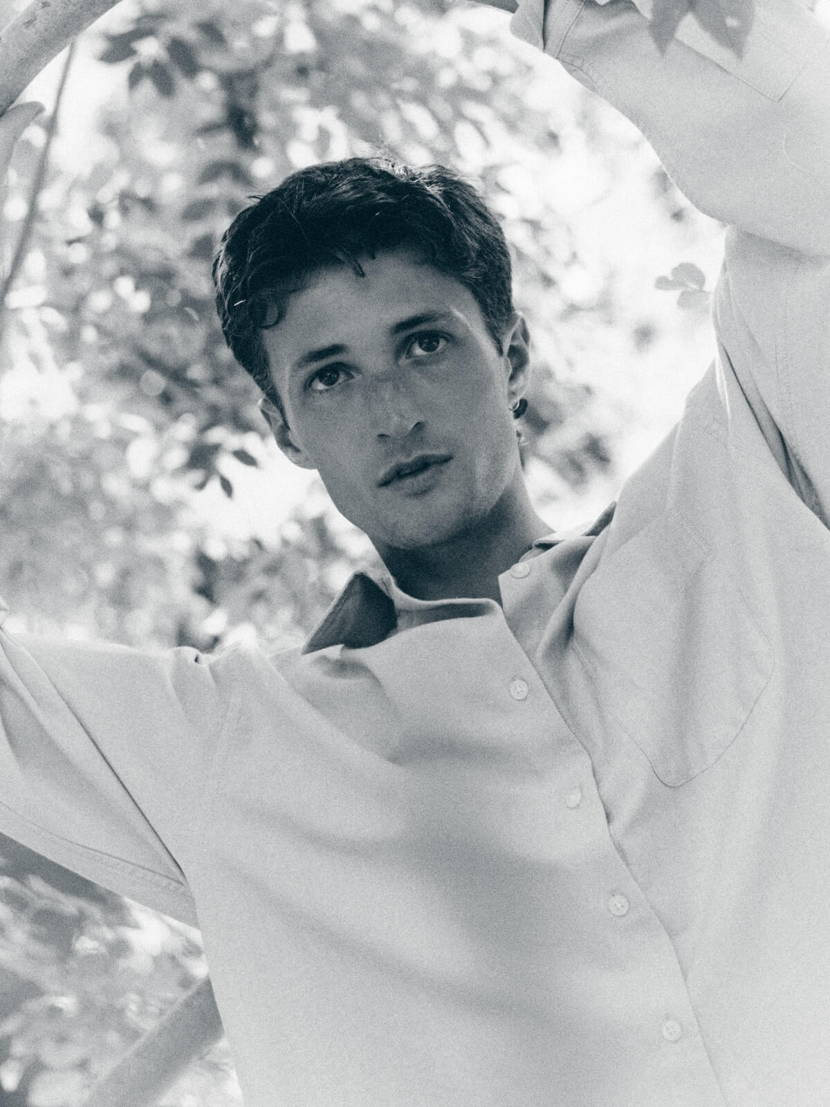 Henry Moodie: Black and white shot against tree leaves for mood swings