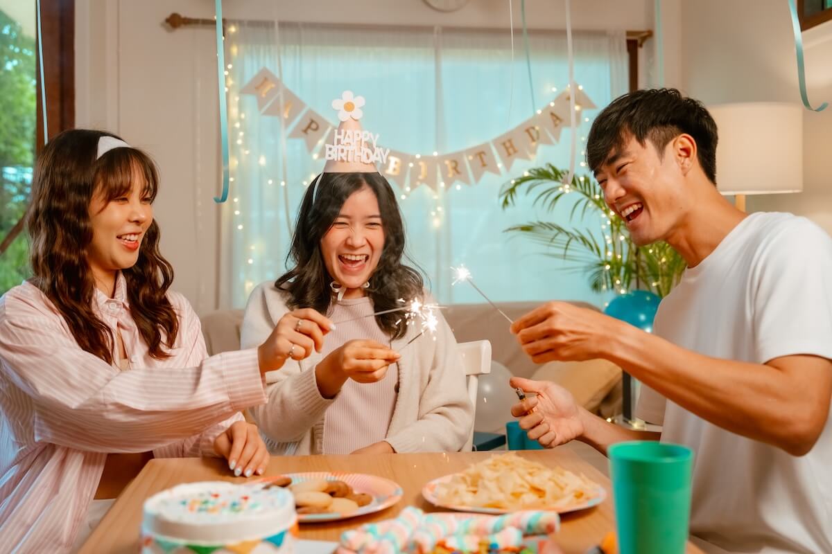 Shutterstock: Friends birthday party with sparklers