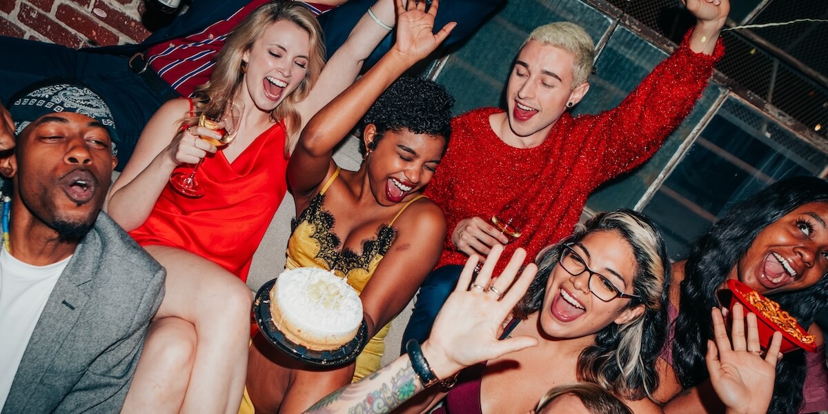 Shutterstock: Friends celebrating a birthday with cake