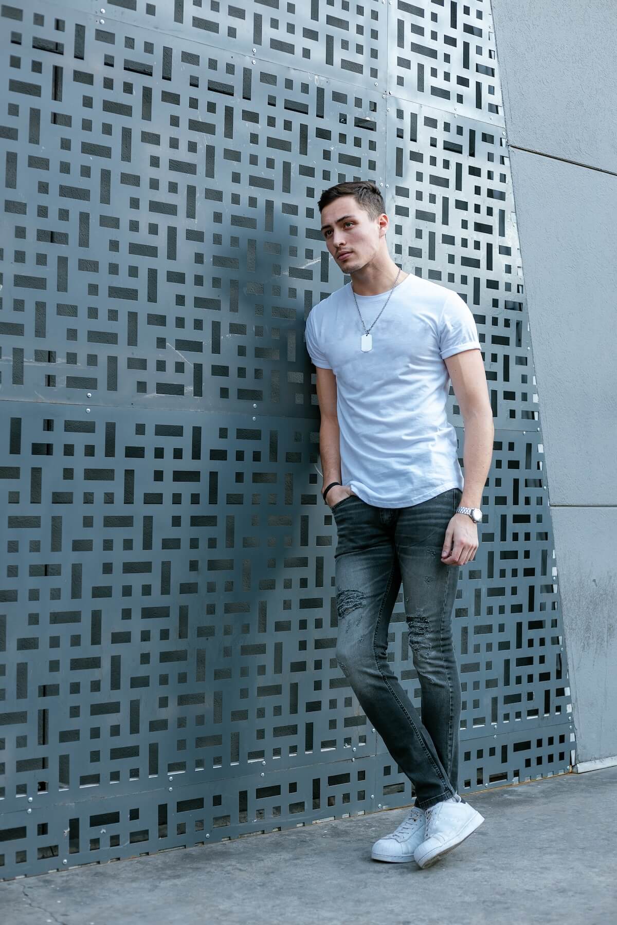 Shutterstock: A male fashion model posing on the streets. A young caucasian man wearing casual clothing. Young male fashion model.