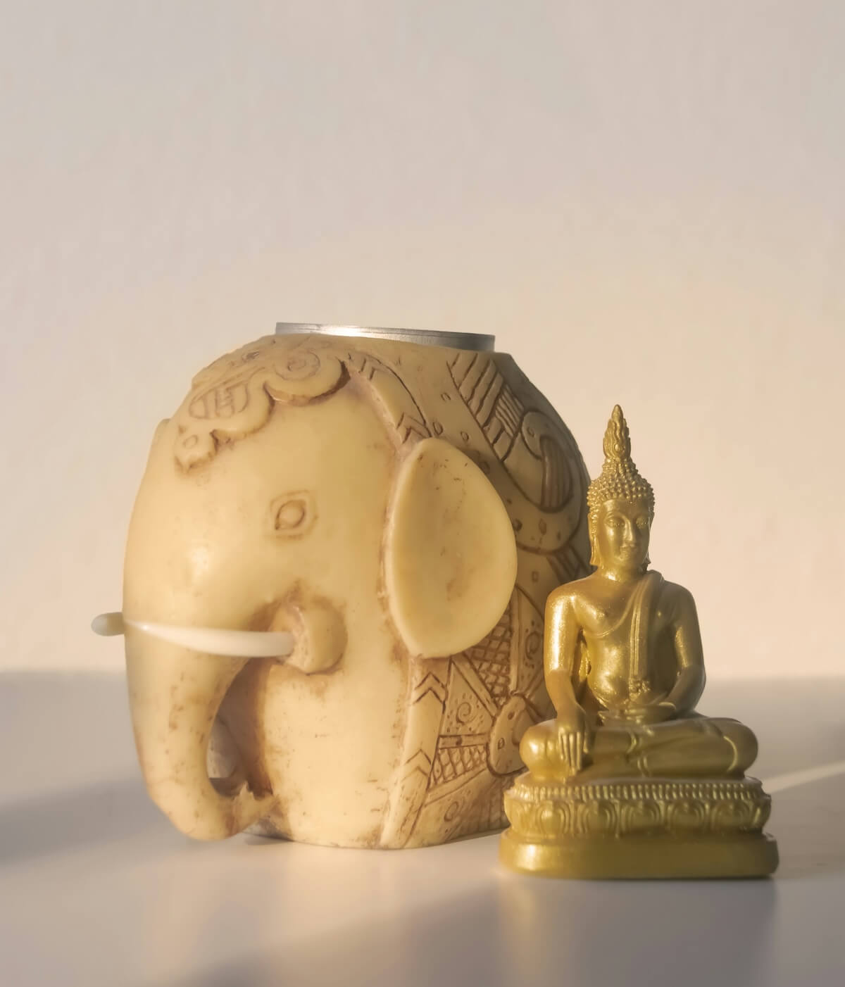 Unsplash: Elephant candle and buddha by Merchi Rodriguez