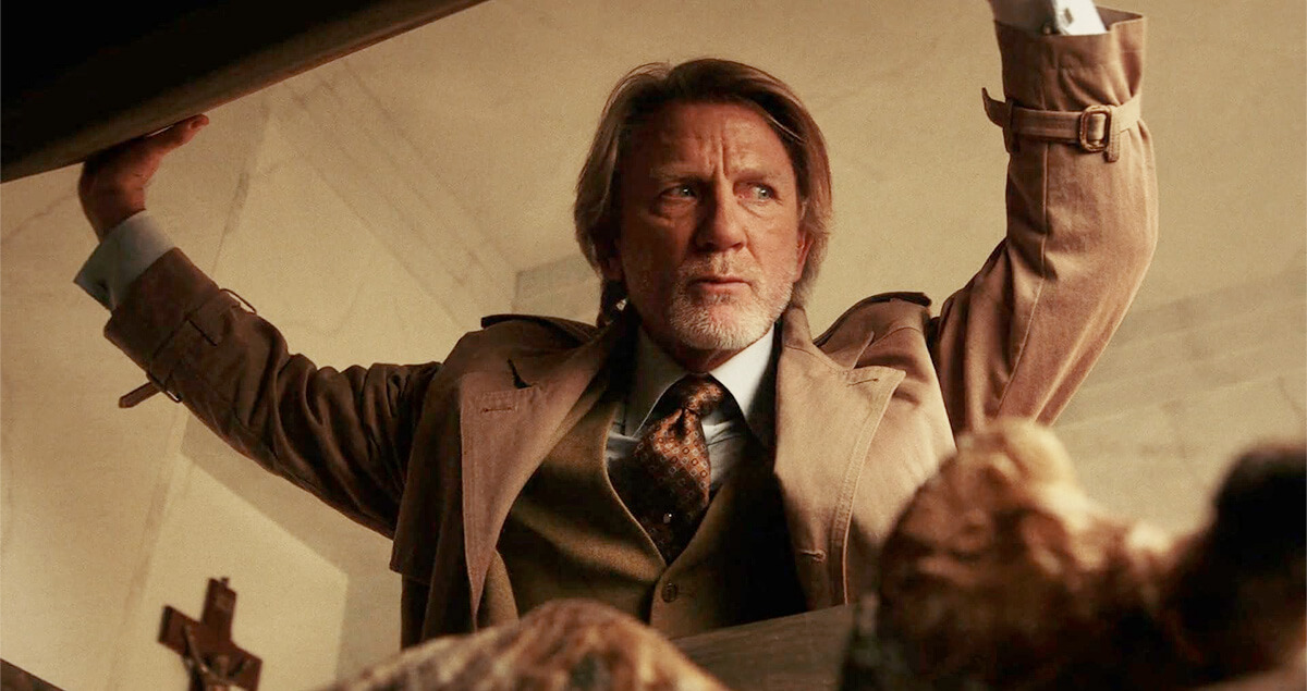 Wake Up Dead Man: A Knives Out Mystery - Benoit Blanc inspecting coffin